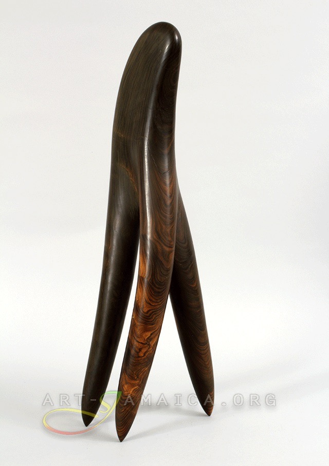A sculpture depicting a comb made of wood